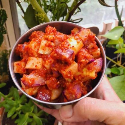 A closeup of a bowl of daikon radish kimchi, made with Maine-grown daikon